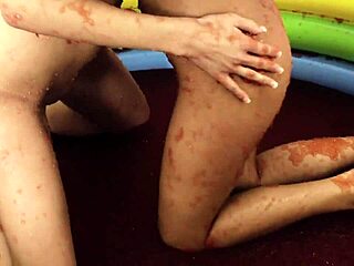Chloe Conrad and Leila Bee masturbate in strawberry jelly pool