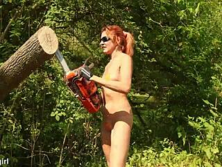 Woman Sawing Wood Outdoors In A Bikini