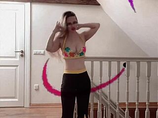 Belly dancer goddess with glasses sways to seductive music rhythmically