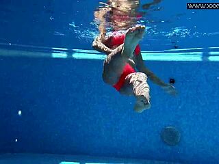 A stunning Russian beauty, Mary Kalisy, by the pool in a steamy scene