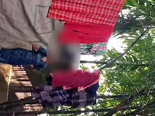 A rural village girl is taking a bath in the open