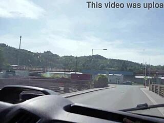 Rainy day, young girl waits for hitchhike rescue
