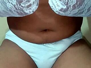 this ladyboy shemale is wearing erotic white panties and bra