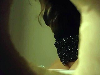Hidden cam caught a babe peeing through wall hole