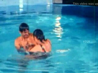 unmarried hot couple enjoys swim pool fun