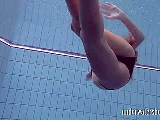 Lucy teasingly takes off her bikini in the pool