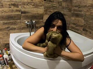 Milfy Calla engages in pee play in bathtub, wearing fur coat and pantyhose, with jerk off instructions