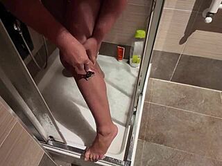 Big breasted milf shaves pussy in shower bathroom!