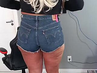 Beautiful tanned woman wearing sexy shorts with tan lines