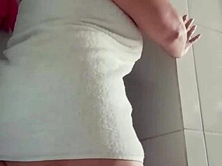 mature woman relaxes in the shower