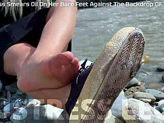 Goddess in tan nylons show her cute nylon soles and toes on the riverside