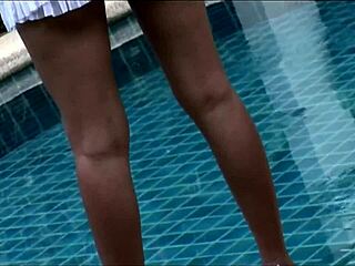 Two asian milfs relax at bed.