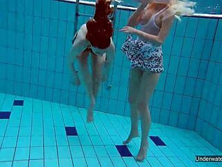 two hot lesbians dive into passionate play in the shimmering pool, exploring every curve underwater