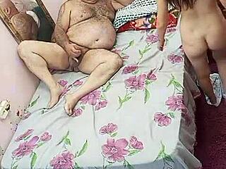 Young girl enjoys time with experienced older man in sensual encounter