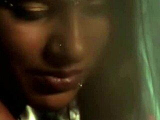 Sensual brunette Asian dancer teases with erotic moves and softcore charm.