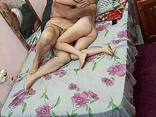 Young girl enjoys time with experienced older man in sensual encounter