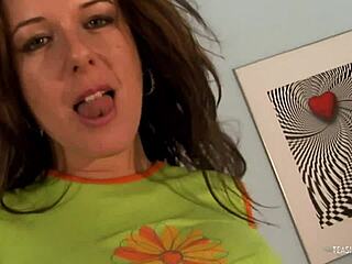 Babe in sneakers rubs her red dildo on her tits and pussy