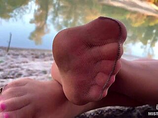 Hey, check out my cute feet in nude tights rubbing together on the autumn river bank