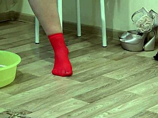 Sexy girl indulges in foot fetish play with socks, nylon stockings, heels, showing off beautiful legs, red pedicure, and hairy pussy.