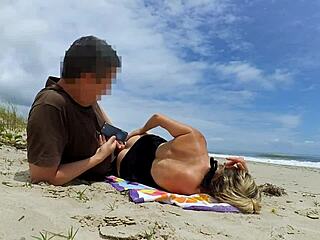 A large tool energizes a resting woman on the beach with outdoor interaction